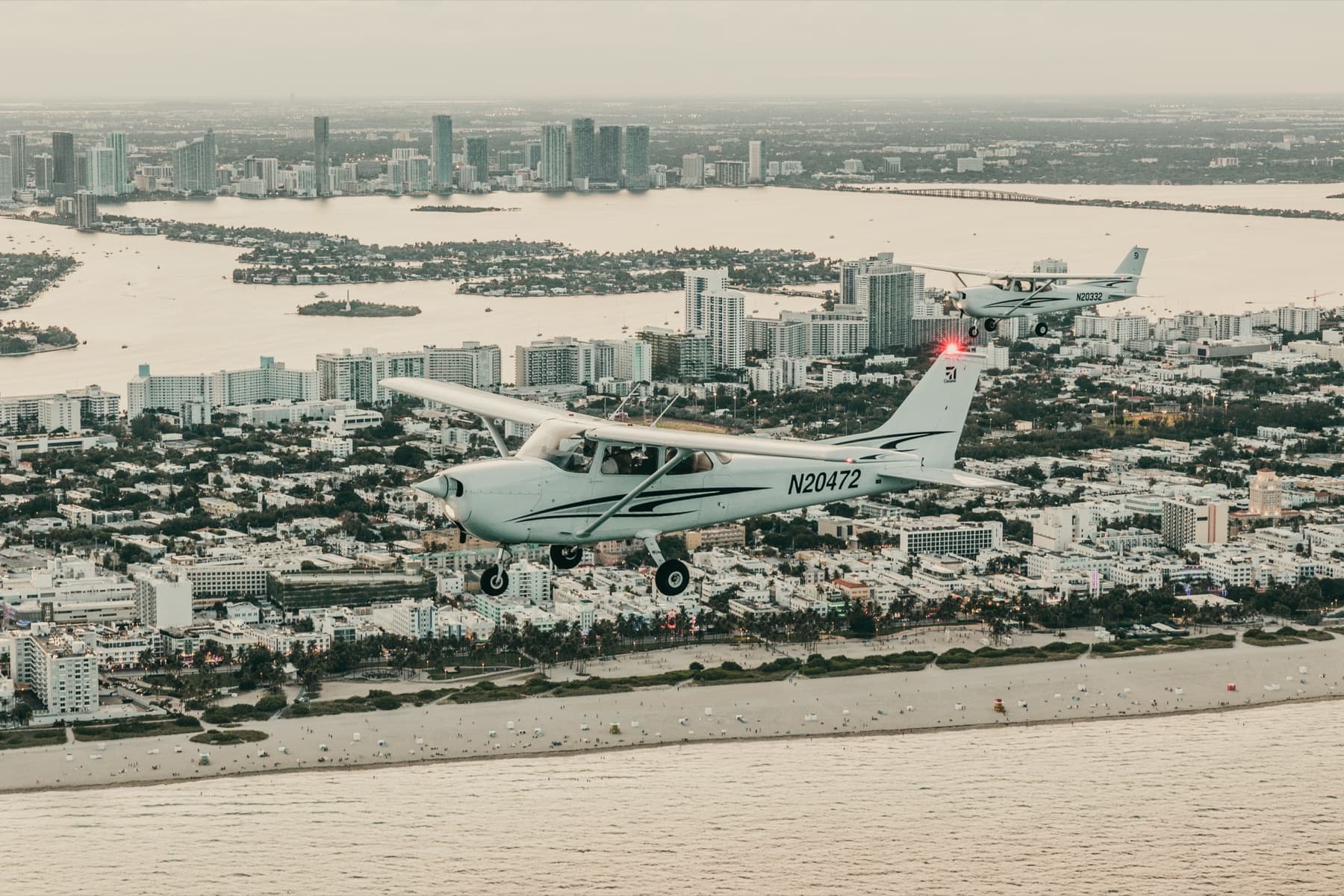 GoFly Academy Cessna 172 Skyhawk N20472 over Miami at golden hour